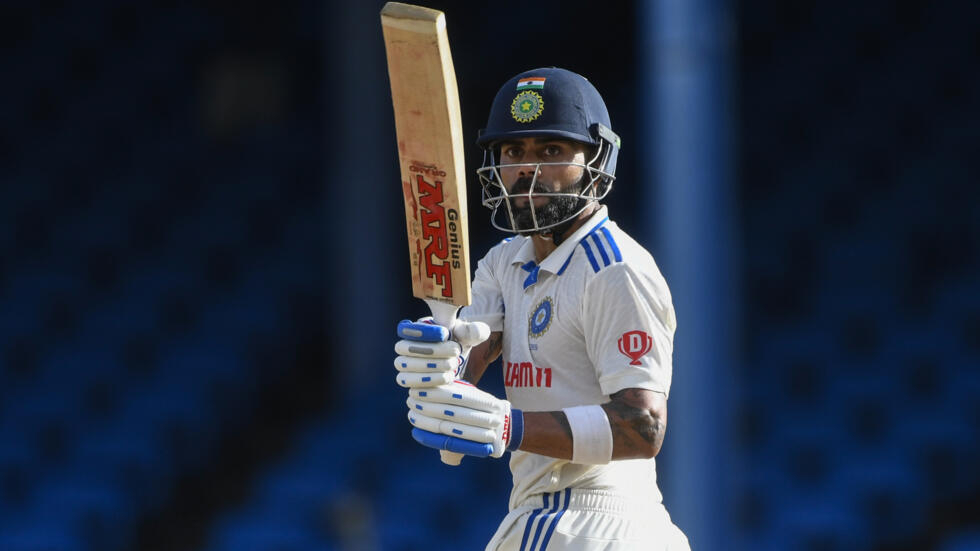 Kohli hits landmark ton but West Indies fight back