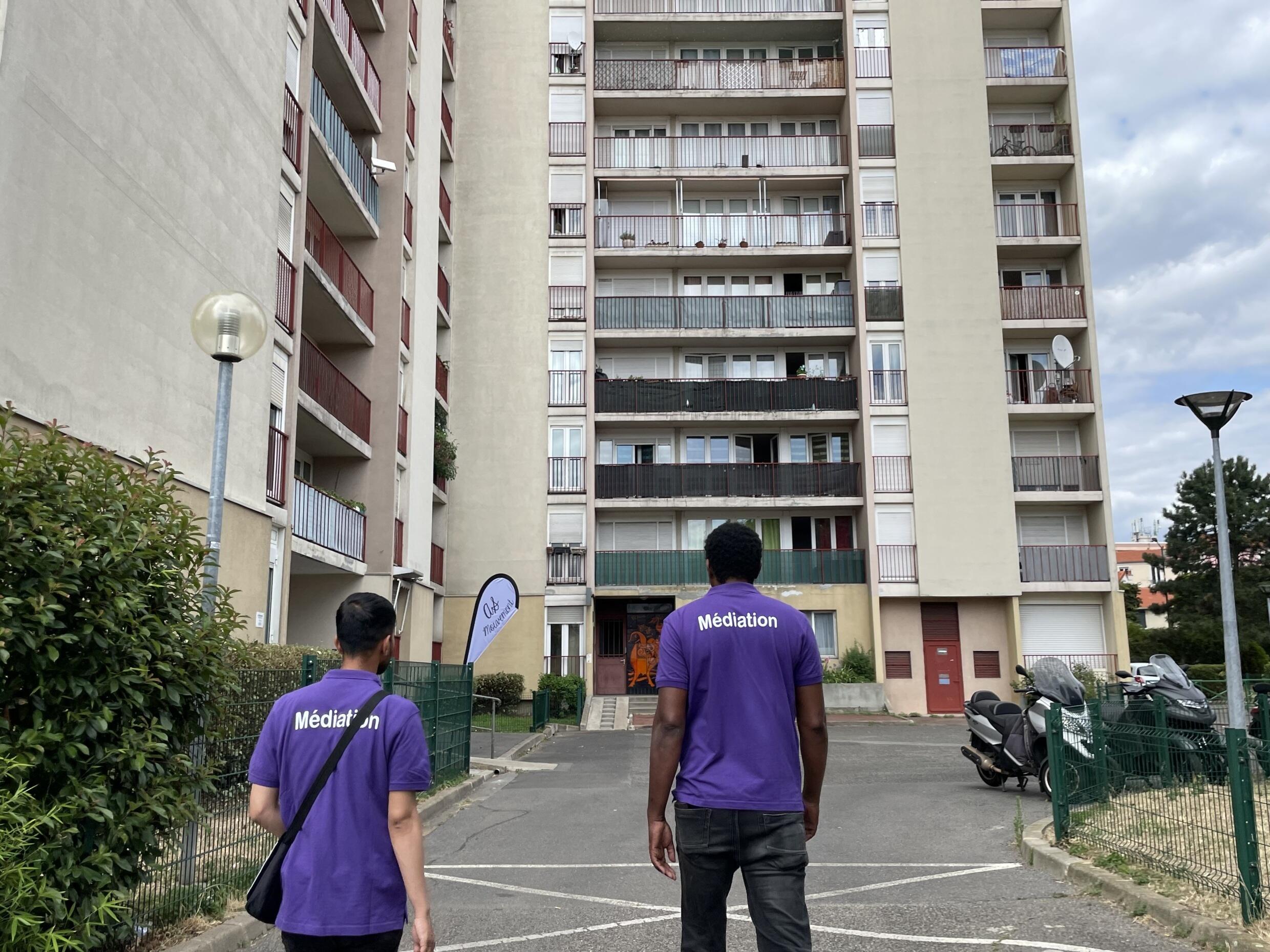 Samba Baye, a social worker in Malakoff, heads to a caretaker's lodge to take stock of the situation a few hours before Bastille Day festivities on July 13, 2023.