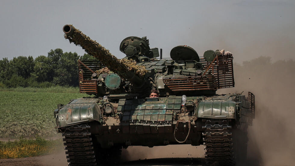 Ukrainian servicemen ride in a tank near a front line, amid Russia's attack on Ukraine, in Donetsk region, Ukraine July 18, 2023.